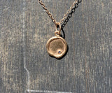 14k rose gold medallion with blue sapphire